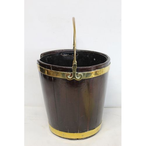 508 - Late 18th century Irish mahogany brass bound plate bucket of tapered coopered form with swing handle... 