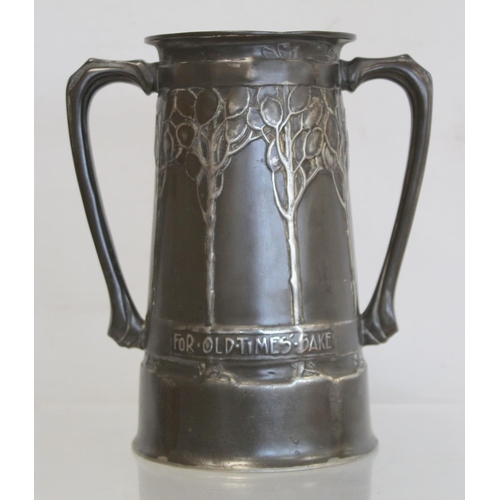 466 - Tudric pewter Art Nouveau twin handled loving cup by David Veazey for Liberty & Co., decorated w... 