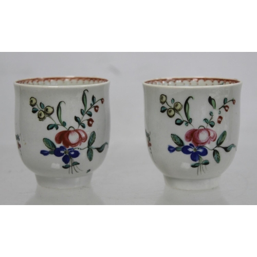 476 - Two 18th century English porcelain coffee cups decorated with polychrome floral sprays and iron red ... 