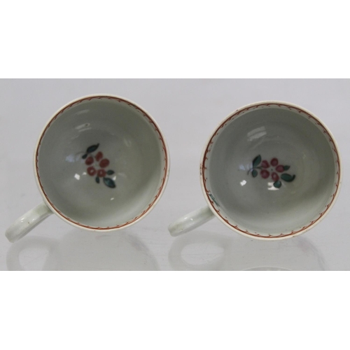 476 - Two 18th century English porcelain coffee cups decorated with polychrome floral sprays and iron red ... 