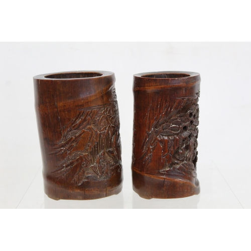 478 - Two 19th or early 20th century Chinese carved bamboo brush pots decorated with figures in landscapes... 