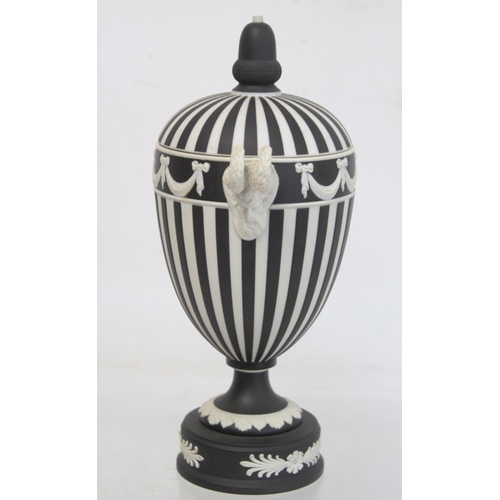 486 - Wedgwood 20th century black dip jasperware covered vase of urn form with twin satyr mask head handle... 