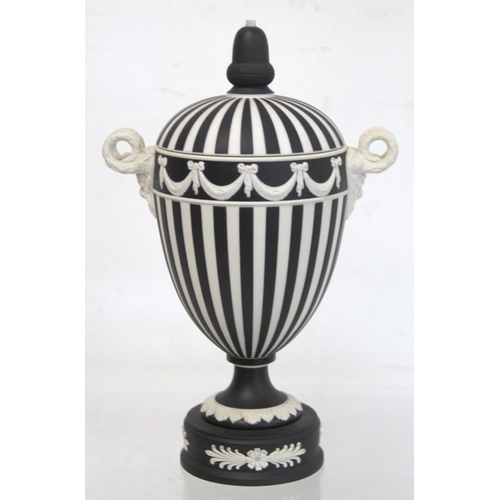 486 - Wedgwood 20th century black dip jasperware covered vase of urn form with twin satyr mask head handle... 