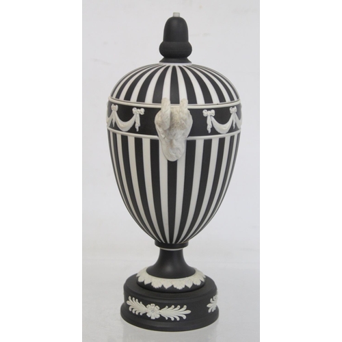 486 - Wedgwood 20th century black dip jasperware covered vase of urn form with twin satyr mask head handle... 