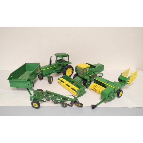 Five vintage ERTL USA die cast John Deere agricultural toys to include a Combine Harvester Plough