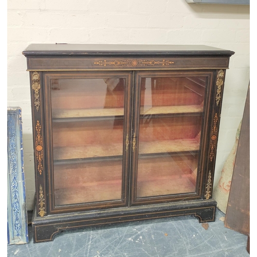 582 - Victorian ebonised and inlaid gilt metal mounted cabinet enclosed by pair of glazed doors on plinth ... 