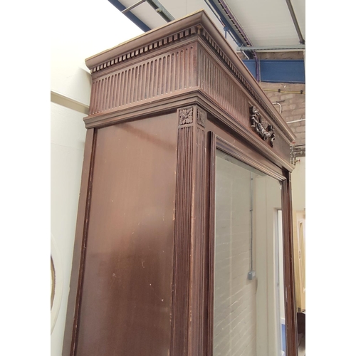 583 - Mahogany floor standing display cabinet, the baize lined interior enclosed by single door over pair ... 