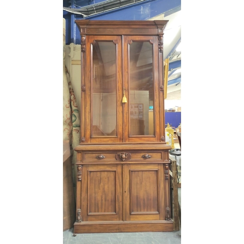 584 - Victorian carved mahogany cabinet bookcase, the upper section enclosed by pair of glazed doors over ... 