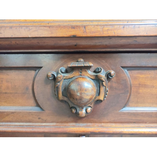 584 - Victorian carved mahogany cabinet bookcase, the upper section enclosed by pair of glazed doors over ... 