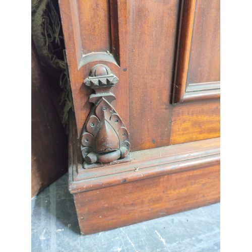 584 - Victorian carved mahogany cabinet bookcase, the upper section enclosed by pair of glazed doors over ... 