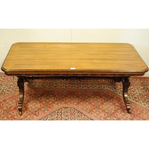 302 - 19th century rosewood and parcel gilt coffee table, the rectangular top with canted corners on three... 