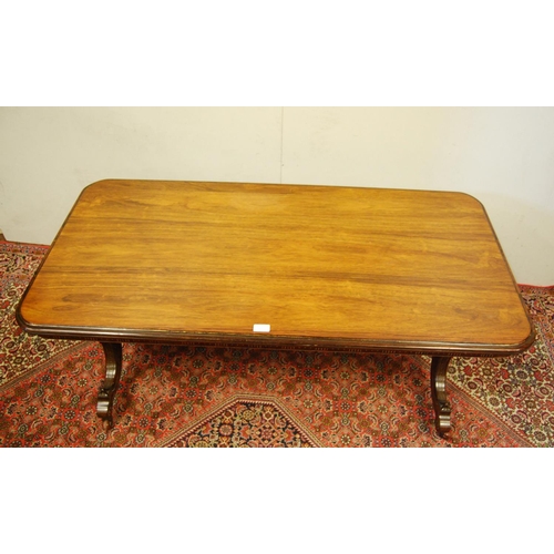 302 - 19th century rosewood and parcel gilt coffee table, the rectangular top with canted corners on three... 