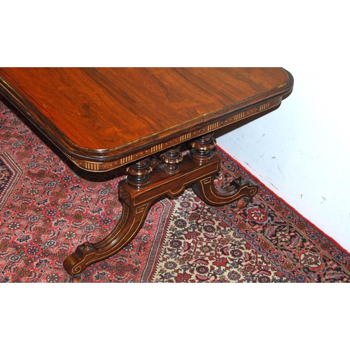 302 - 19th century rosewood and parcel gilt coffee table, the rectangular top with canted corners on three... 