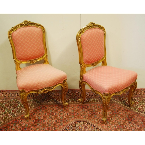 305 - Pair of Louis XV style giltwood parlour chairs decorated with moulded roses, floral panels and acant... 