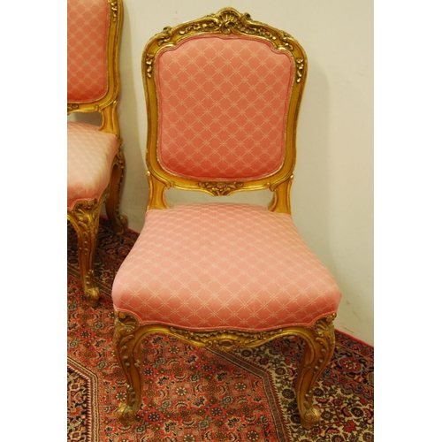 305 - Pair of Louis XV style giltwood parlour chairs decorated with moulded roses, floral panels and acant... 