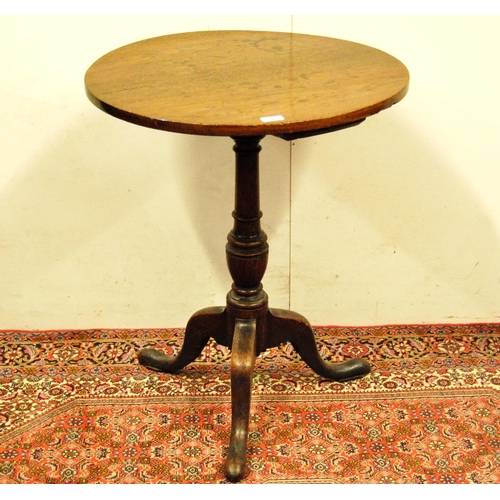 307 - George III oak tripod table, the circular top on a turned column and tripod supports, 75cm high and ... 