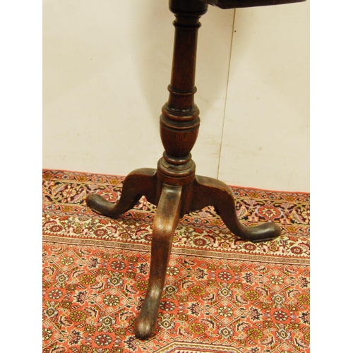 307 - George III oak tripod table, the circular top on a turned column and tripod supports, 75cm high and ... 