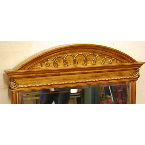 311 - Reproduction gilt wall mirror in the Victorian manner, 117cm high and 91cm wide.
