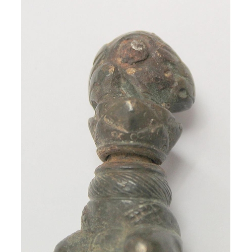 290 - Eastern bronze weight or toggle with ram's head finial, moulded figure of buddha as a child and fist... 