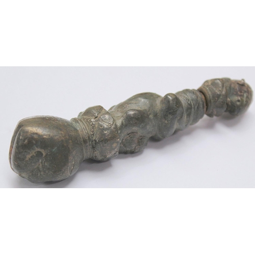 290 - Eastern bronze weight or toggle with ram's head finial, moulded figure of buddha as a child and fist... 