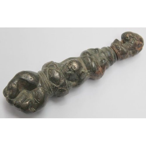 290 - Eastern bronze weight or toggle with ram's head finial, moulded figure of buddha as a child and fist... 