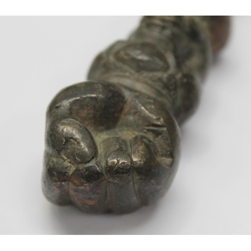 290 - Eastern bronze weight or toggle with ram's head finial, moulded figure of buddha as a child and fist... 