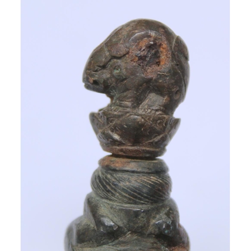 290 - Eastern bronze weight or toggle with ram's head finial, moulded figure of buddha as a child and fist... 