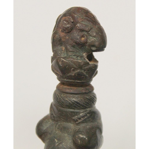 290 - Eastern bronze weight or toggle with ram's head finial, moulded figure of buddha as a child and fist... 