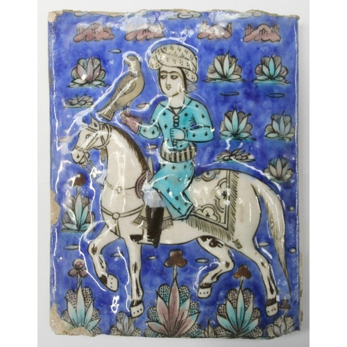 462 - Persian glazed tile or panel decorated in a typical Qajar manner with a figure on horseback hunting ... 