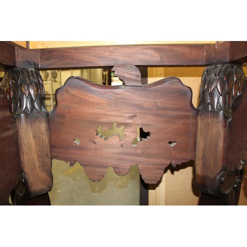 562 - Impressive walnut console table base on scroll supports profusely carved with grotesque birds at eac... 