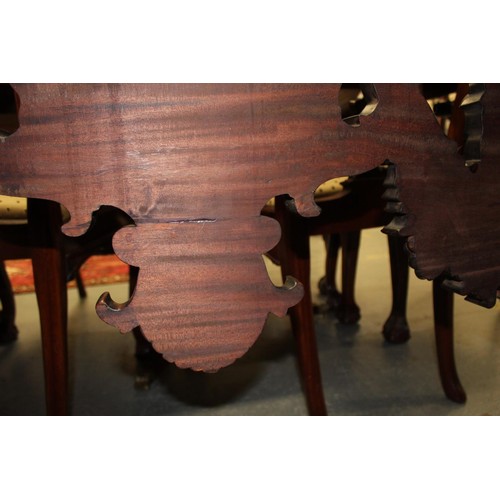 562 - Impressive walnut console table base on scroll supports profusely carved with grotesque birds at eac... 