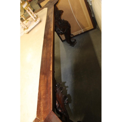 562 - Impressive walnut console table base on scroll supports profusely carved with grotesque birds at eac... 