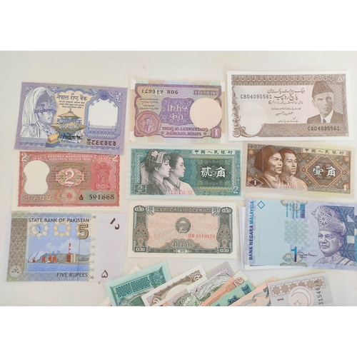 127 - Banknotes- Pristine world banknotes predominantly comprising of Asian issues and dating from the 197... 