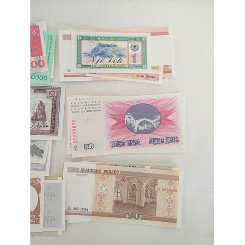 130 - Banknotes- Pristine world banknotes predominantly comprising of Asian, Eastern Block & African i... 