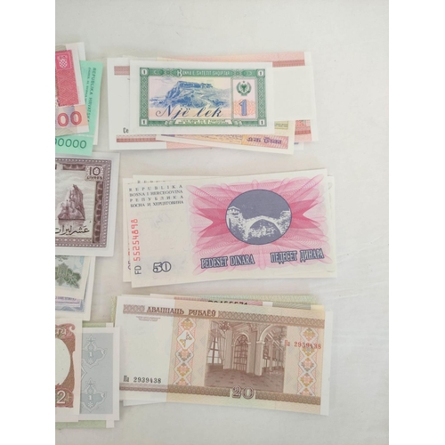 130 - Banknotes- Pristine world banknotes predominantly comprising of Asian, Eastern Block & African i... 