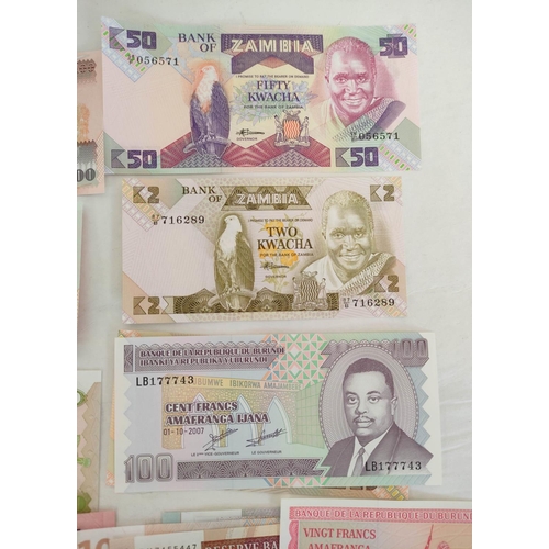 131 - Banknotes- Pristine world banknotes predominantly comprising of African issues dating from the 1956s... 