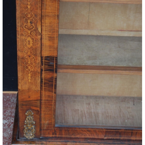 313 - 19th century French inlaid burr walnut pier cabinet, the inlaid frieze above a glazed door enclosing... 