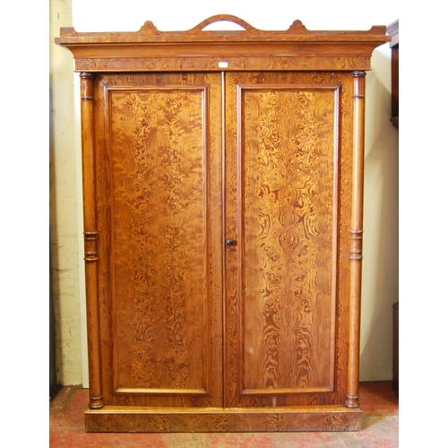 314 - Victorian pitch pine wardrobe, the shaped cornice above two doors enclosing fitted drawers and hangi... 