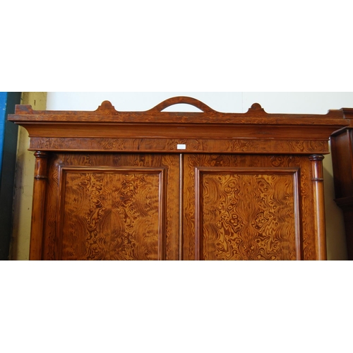 314 - Victorian pitch pine wardrobe, the shaped cornice above two doors enclosing fitted drawers and hangi... 