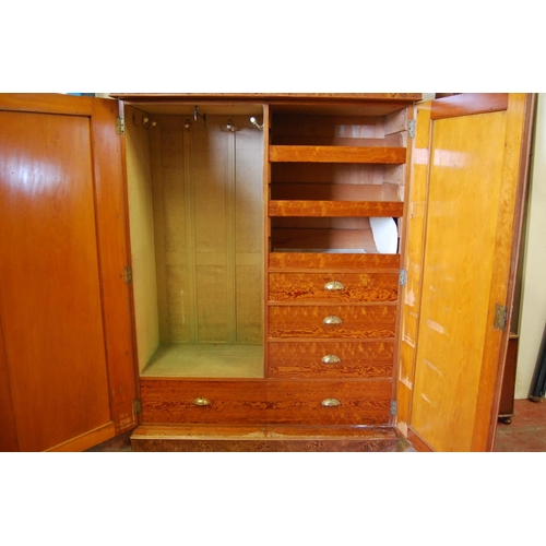 314 - Victorian pitch pine wardrobe, the shaped cornice above two doors enclosing fitted drawers and hangi... 