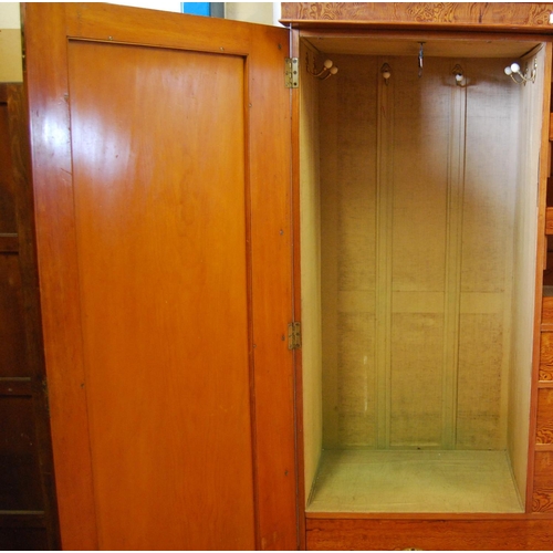 314 - Victorian pitch pine wardrobe, the shaped cornice above two doors enclosing fitted drawers and hangi... 