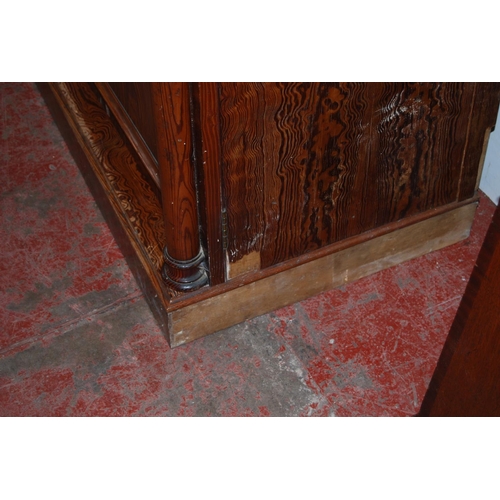 314 - Victorian pitch pine wardrobe, the shaped cornice above two doors enclosing fitted drawers and hangi... 