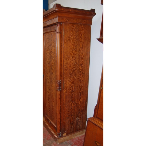 314 - Victorian pitch pine wardrobe, the shaped cornice above two doors enclosing fitted drawers and hangi... 