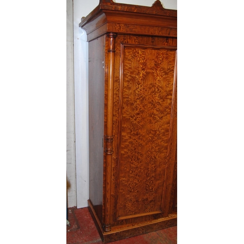 314 - Victorian pitch pine wardrobe, the shaped cornice above two doors enclosing fitted drawers and hangi... 