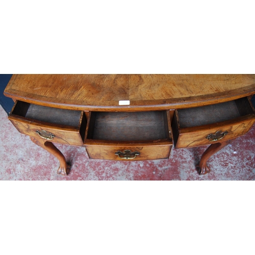 315 - Queen Anne-style walnut desk, with three short drawers above a shaped apron, on cabriole legs with b... 