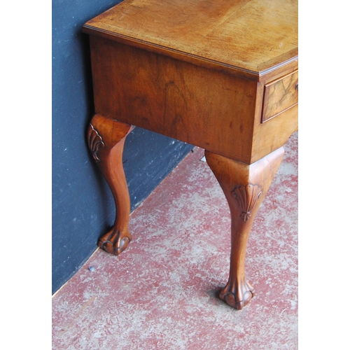 315 - Queen Anne-style walnut desk, with three short drawers above a shaped apron, on cabriole legs with b... 