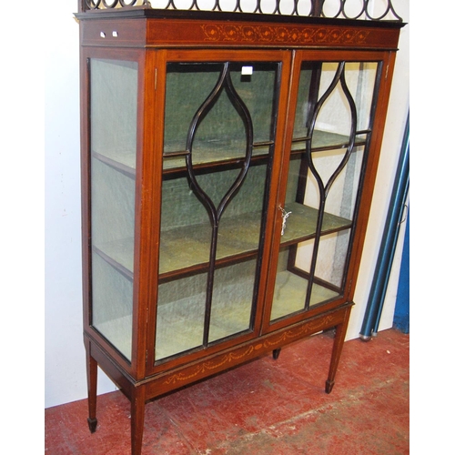 317 - Edwardian inlaid mahogany display cabinet, with a concentric pierced pediment top above an inlaid fr... 