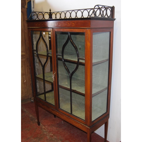 317 - Edwardian inlaid mahogany display cabinet, with a concentric pierced pediment top above an inlaid fr... 