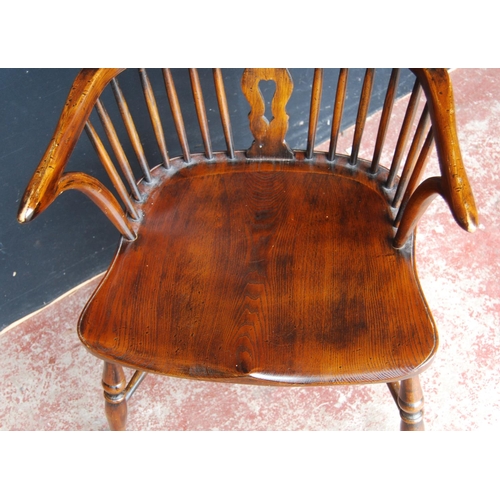 325 - 19th century ash and elm Windsor armchair, the hoop stick back with a pierced splat and dish seat, o... 