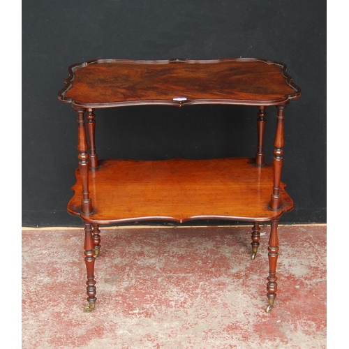 330 - 19th century mahogany window table, with two shaped tiers, on turned supports with brass castors, 75... 
